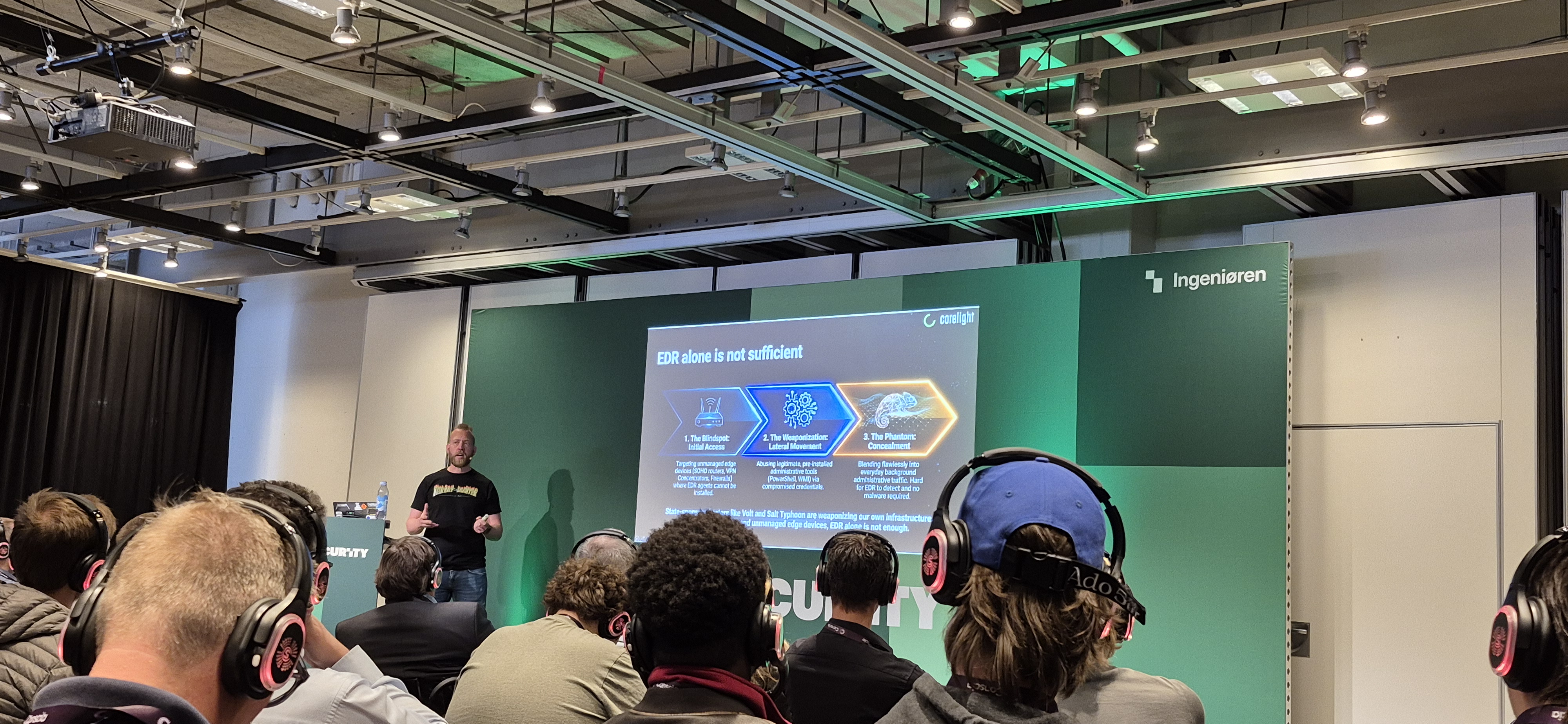 Speaker on stage at V2 Security